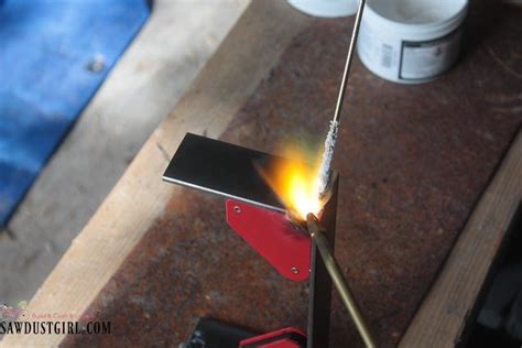 wood centerpiece with metal brackets|brazing steel centerpiece brackets.